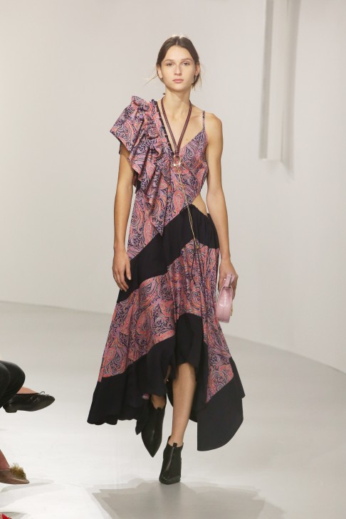 Paisley print dress with a sensuous cut-out at the waist.