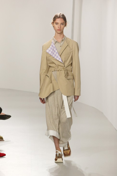 Deconstructed jacket with a gingham print lapel worn with a jersey ensemble. 