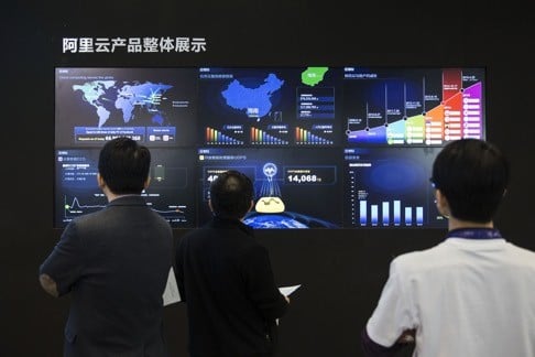 People look at screens displaying the overall scope of AliCloud. Alibaba’s bet on data technology is driving greater investment in areas including ways to protect user privacy as it battles Amazon.com for customers globally. PHOTO: Bloomberg