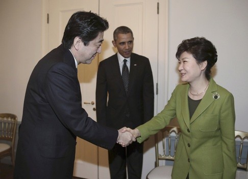 South Korean President Park Geun-hye met Japanese Prime Minister Shinzo Abe in March 2014, along with US President Barack Obama. Photo: AP