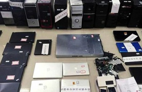 Confiscated computer equipment and other evidence seized in the operation. Photo: China Police Daily