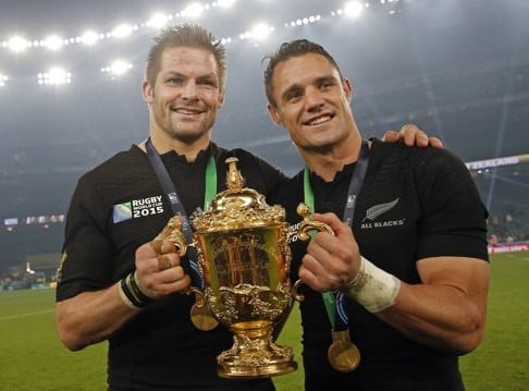 Richie McCaw and Dan Carter hold the trophy aloft after the Rugby World Cup final. Photo: AP