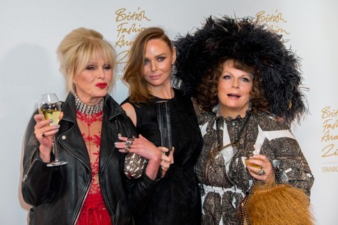 Stella McCartney (centre) with her Brand award, presented by Joanna Lumley (left) and Jennifer Saunders. Photo: AP