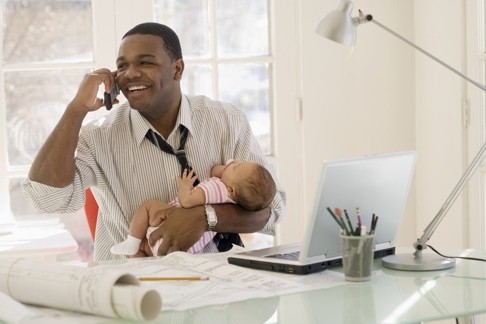 A work-life balance survey found 59 per cent of men agree that a family-friendly working environment is one of the top considerations when they choose to join, stay with, or leave a company. Photo: Corbis