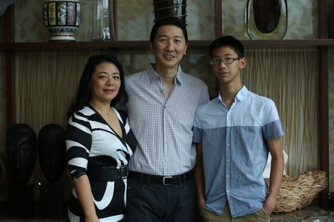 Allen Ha with his wife Cora and 14-year-old son Matthew. Photo: Jonathan Wong