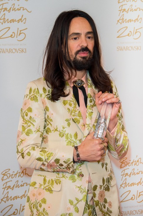 Alessandro Michele holds the International Designer award he collected on behalf of Gucci. Photo: AP
