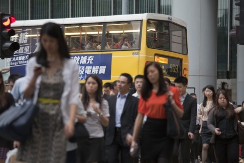 Women in Hong Kong may have more opportunities than those in many other Asian economies, but they are still expected to balance their working life with looking after their family. Photo: Bloomberg