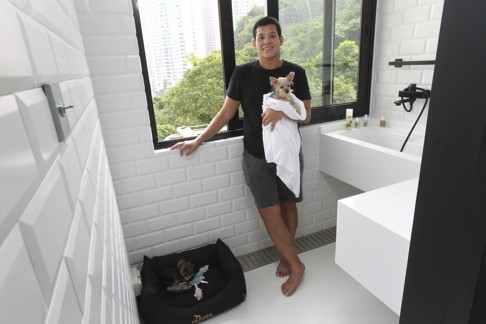 A white floor and wall tiles makes the dogs’ room at Harold Ho’s home easy to clean.