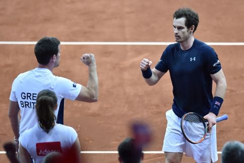 Andy Murray celebrates with Britain's captain Leon Smith after winning. Photo: AFP