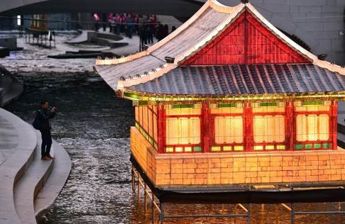 A lantern in the shape of a Korean royal palace is featured at the Seoul Lantern Festival at Cheonggyecheon stream in central Seoul. The festival is part of a campaign by South Korea to attract more foreign tourists. Photo: AFP