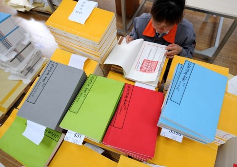 Duplicates of classic Chinese book, the Siku Quanshu, (Complete Library in the Four Branches of Literature). Classics and old texts are used for Chinese comprehension. Photo: Xinhua