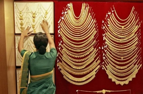 A saleswoman arranges gold necklaces in a jewellery showroom in Kochi, India. China and India owe much of their international clout to the fact they have been able to stay out of wars and concentrate on building 21st-century economies. Photo: Reuters