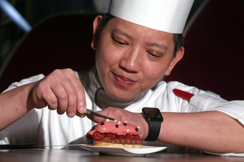 Roy Lau, pastry chef at Ebb & Flow, with one of his creations. Photo: Edward Wong