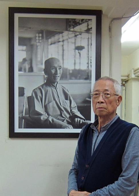 Chu Shong-tin poses in front of a photo of Ip Man. Photo: courtesy of Nima King