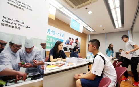 Students and staff discus vocational education at Hong Kong Institute of Vocational Education in Cheung Sha Wan. Students usually see getting a diploma as the way to a good job. Photo: Sam Tsang