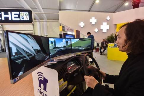 A visitor experiences a driving simulator at the Light of the Internet Expo in Wuzhen on Tuesday. Photo: Xinhua