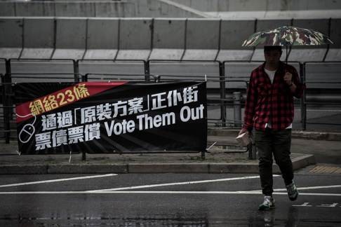 A banner opposing the proposed changes to the copyright law hangs outside the Legislative Council building. The amendment bill misses some opportunities to make the law future-ready, but it is difficult to see why it would stifle creativity. Photo: AFP