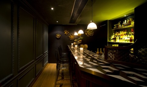 The intimate Envoy atop the Wellington in Central features a long wooden bar. Photo: SCMP Pictures