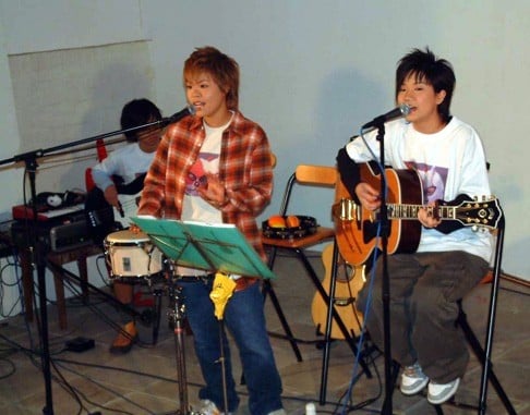 A young Lam (left) with Ellen Joyce Loo in an early performance as at17 in 2003.