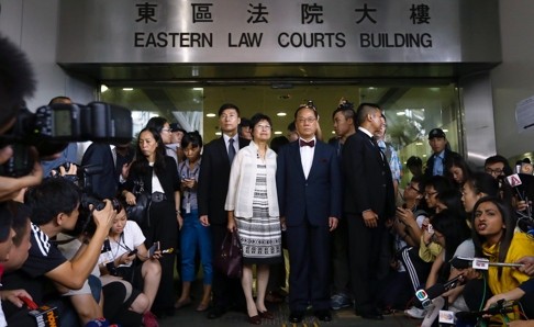 Donald Tsang is mobbed by the media and doesn’t flinch. Photo: Sam Tsang