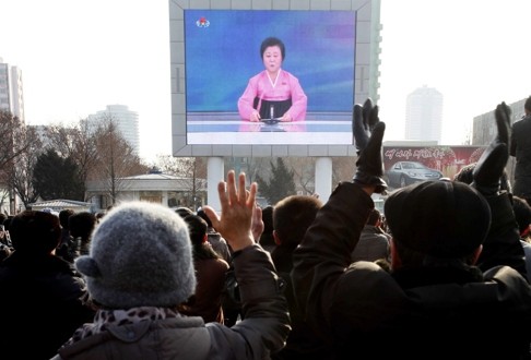 North Koreans watch a news broadcast on a video screen outside Pyongyang Railway Station. North Korea has long claimed it has the right to develop nuclear weapons to defend itself against the US, a nuclear power with which it has been in a state of war for more than 65 years. Photo: AP