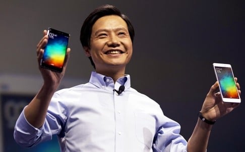 Xiaomi CEO Lei Jun is pictured with some of his company’s handsets in the this file photo. Xiaomi has been called an Apple clone for years but has also developed its own unique business model. Photo: