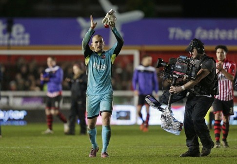 Exeter City’s Robert Olejnik applauds the fans at the end of the game. Photo: Reuters