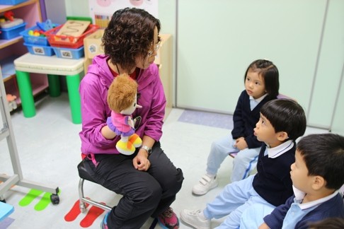 A small-group English lesson at the Bradbury Child Care Centre.