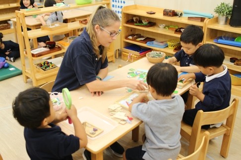 A small group guided by an English teacher at the Island Children’s Montessori International Nursery and Kindergarten.