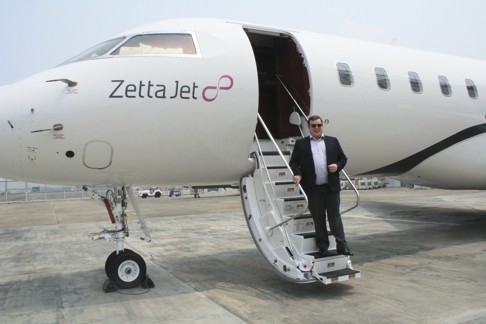 Zetta Jet co-founder Geoffrey Cassidy with a Zetta Jet aircraft at a hangar near Seletar Airport in Singapore.