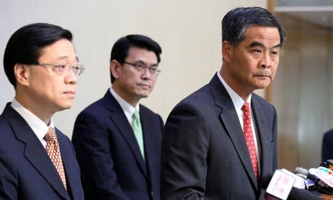 Hong Kong Chief Executive Leung Chun-yin (R); with Undersecretary for Security Lee Ka-chiu (L) and Director of the Chief Executive’s Office Edward Yau Tang-wah (centre). Photo: SCMP/Nora Tam