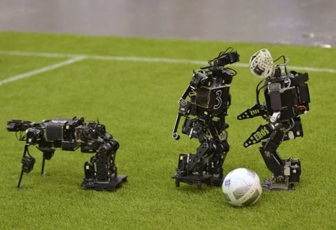 Humanoid robots compete during the 2015 Robocup in Hefei, Anhui province on July 22, 2015. The Robocup, or Robot Soccer World Cup, is an annual international robotics competition. Photo: Reuters