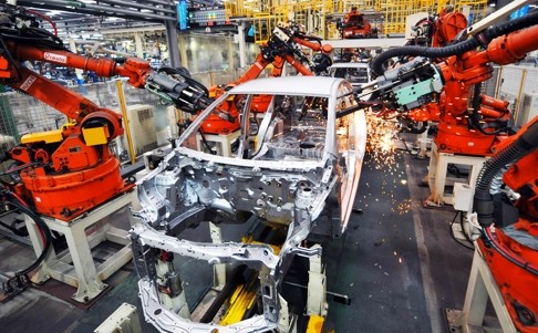 Robotic arms work on an assembly line at a car plant for China’s Geely in east China's Zhejiang province. Photo: Xinhua