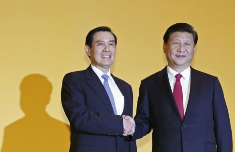 Xi Jinping (right) shakes hands with Ma Ying-jeou during a summit in Singapore in November. This was the first time leaders of the two sides had met in more than 60 years. Photo: Reuters