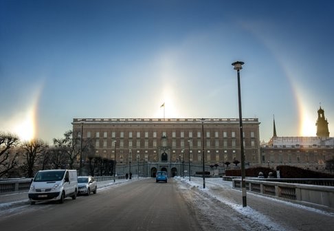 A halo is seen around the sun above the Royal Palace in Stockholm on Friday. Sweden is in the hunt to become the world’s first cashless society as mobile app-based payment transactions take off. Photo: REUTERS