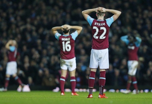 West Ham players rue a near miss. Photo: Reuters