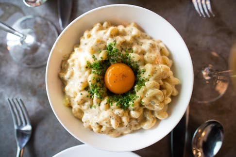 Vinny Lauria’s mac ’n’ cheese has an egg yolk and black truffle.