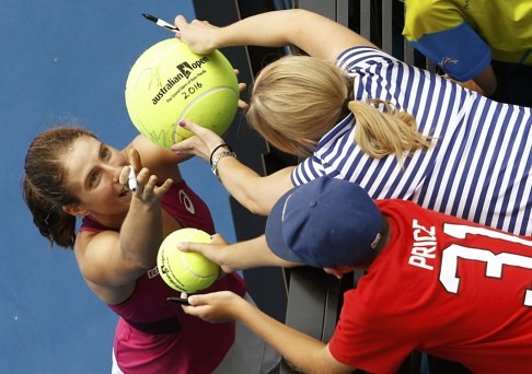 Johanna Konta signs autographs after winning her quarter-final. Photo: Reuters
