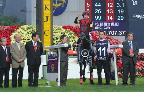 Yutaka Take celebrates his win aboard A Shin Hikari.