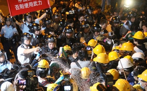 Police pepper spray pro-democracy protesters during the Occupy Central campaign in November, 2014. Student activists took the lead in the civil disobedience movement. Photo: Edward Wong