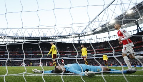 Burnley keeper Tom Heaton is spreadeagled after being beaten by a shot from Alexis Sanchez (not pictured). Photo: Reuters