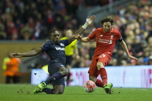 Liverpool's Joe Allen fights for the ball against West Ham's Michail Antonio. Photo: AP