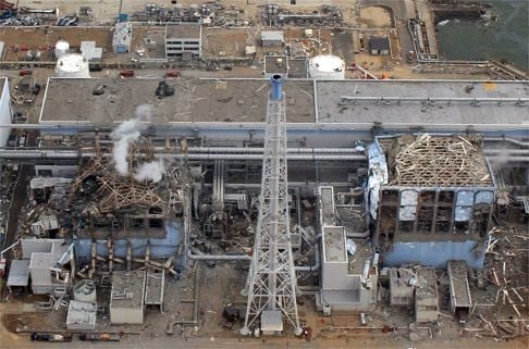 An aerial view of Japan’s stricken Fukushima Dai-Ichi power plant reactor, including smoke rising from one reactor (left), following the meltdown of three of its reactors after a tsunami in March 2011. Photo: AFP