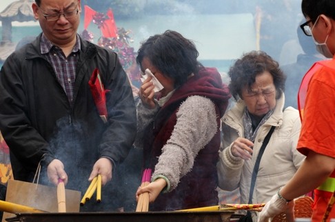 Smoke gets in your eyes, but the burning incense sticks smell so good. Photo: SCMP Pictures