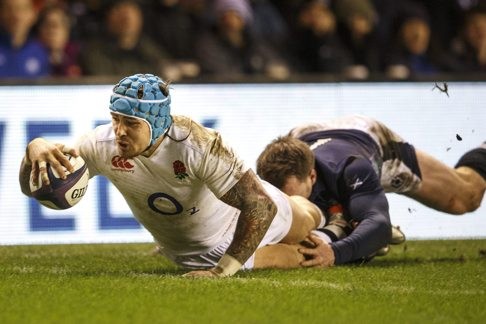 Jack Nowell goes over for England’s second try after Billy Vunipola smashed a hole in the Scottish defence. Photo: EPA