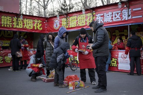 Stalls like this in Beijing have been feeling the pinch as sales took a dive. Photo: AP