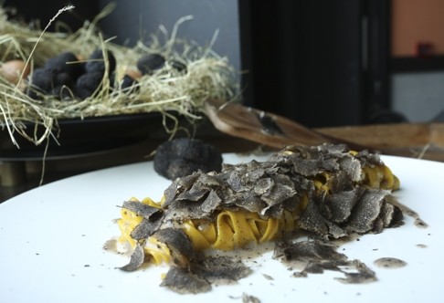 Home-made tagliatelle with parmigiano sauce and shaved Perigord black truffle.