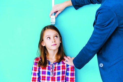 To raise healthy children, parenting experts offer simple, intuitive advice including regular medical check-ups. Photo: Corbis