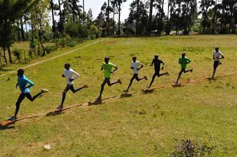 A file photo taken on January 13, 2016 shows Kenyan athletes running during their training session in Iten in the Rift Valley, 329 kms north of Nairobi. In the latest scandal to hit the IAAF, top Kenyan athlete Francisca Koki, suspended for doping, said she and fellow runner Joyce Zakari were asked to pay nearly $50,000 in bribes to the national athletics federation chief to help the case. Photo: AFP