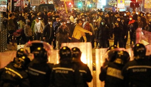 Rioters confront police in Mong Kok during Chinese New Year. Photo: Edward Wong
